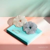 The Korean-style polka dot wrinkled checkered large intestine hair band exudes a fresh and sweet charm. It is fashionable with a hair tie and bun hairstyle details Picture
